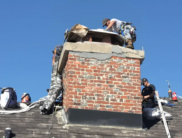 Kannapolis Chimney Sweep installing a custom chimney crown in Kannapolis, NC