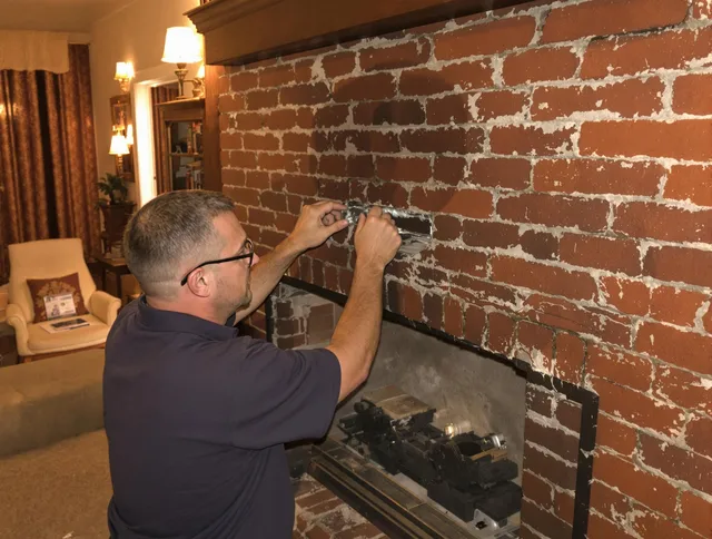 Kannapolis Chimney Sweep expert fixing a fireplace in Kannapolis, NC
